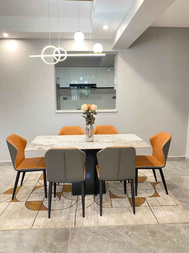 A dining area at Golden Street 3 bedroom unit