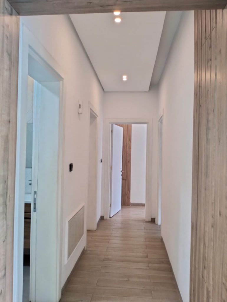 corridor leading to rooms at Grand Premier Apartment-