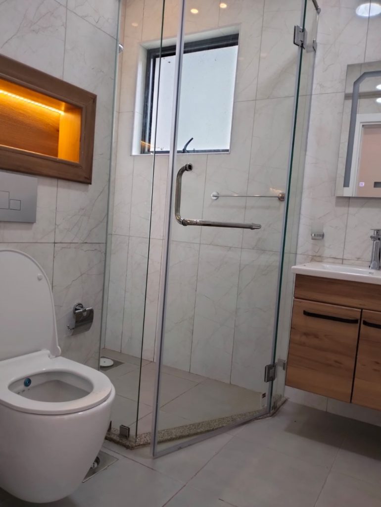 a modern bathroom at Grand Premier Apartment