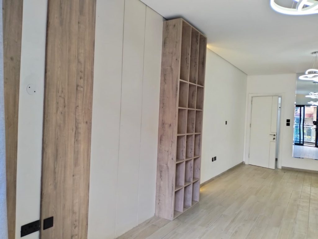 bedroom with inbuild wardrobes at Grand Premier Apartment