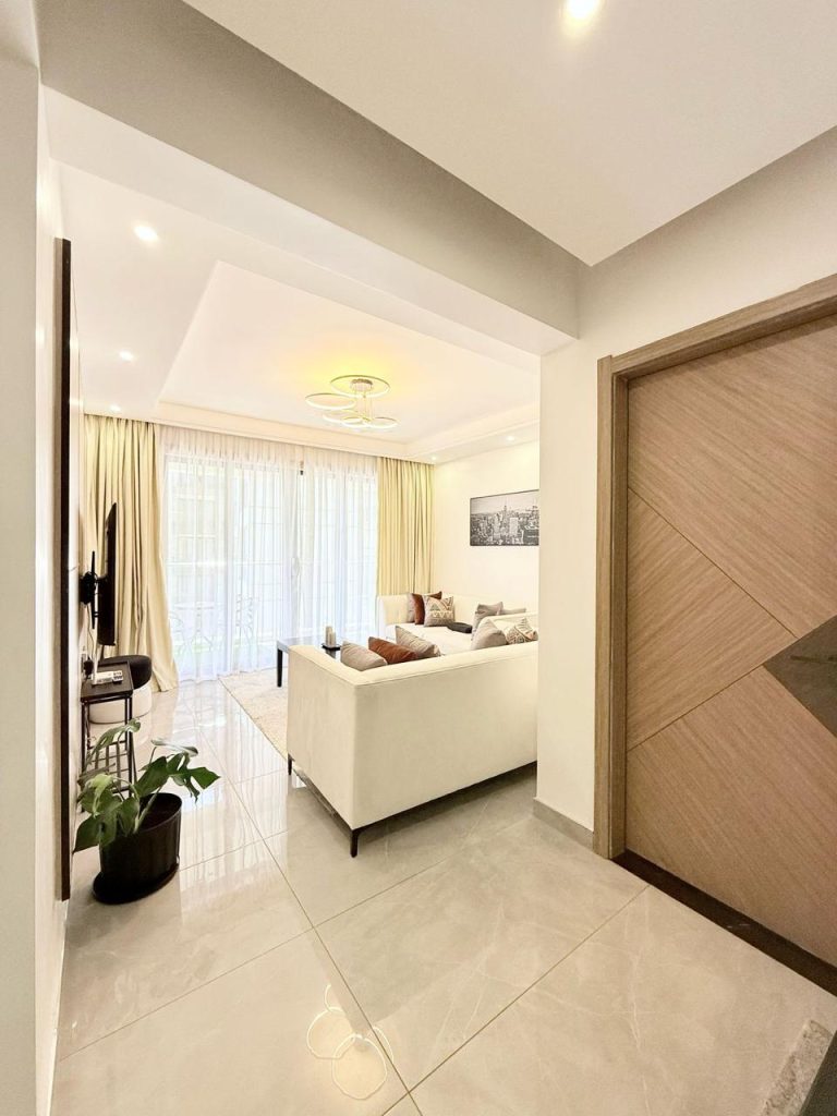 the view of the living room from the kitchen at Furnished Apartment near Netherlands Embassy