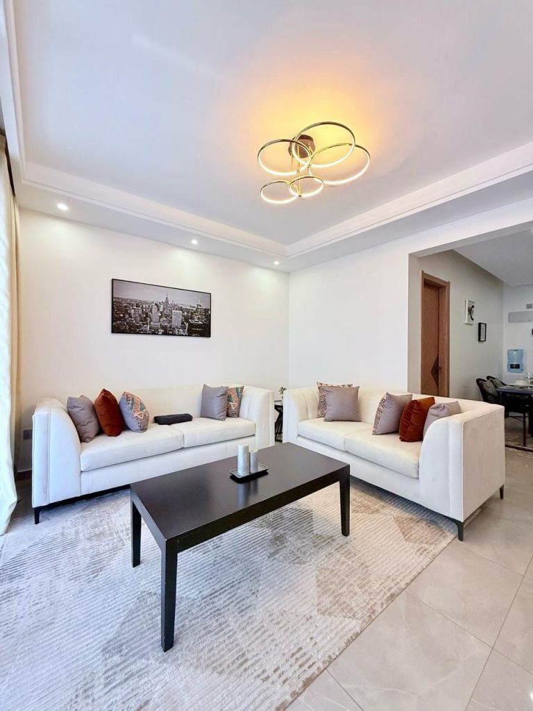 beautiful living area with 2 couches and a coffee table at Furnished Apartment near Netherlands Embassy