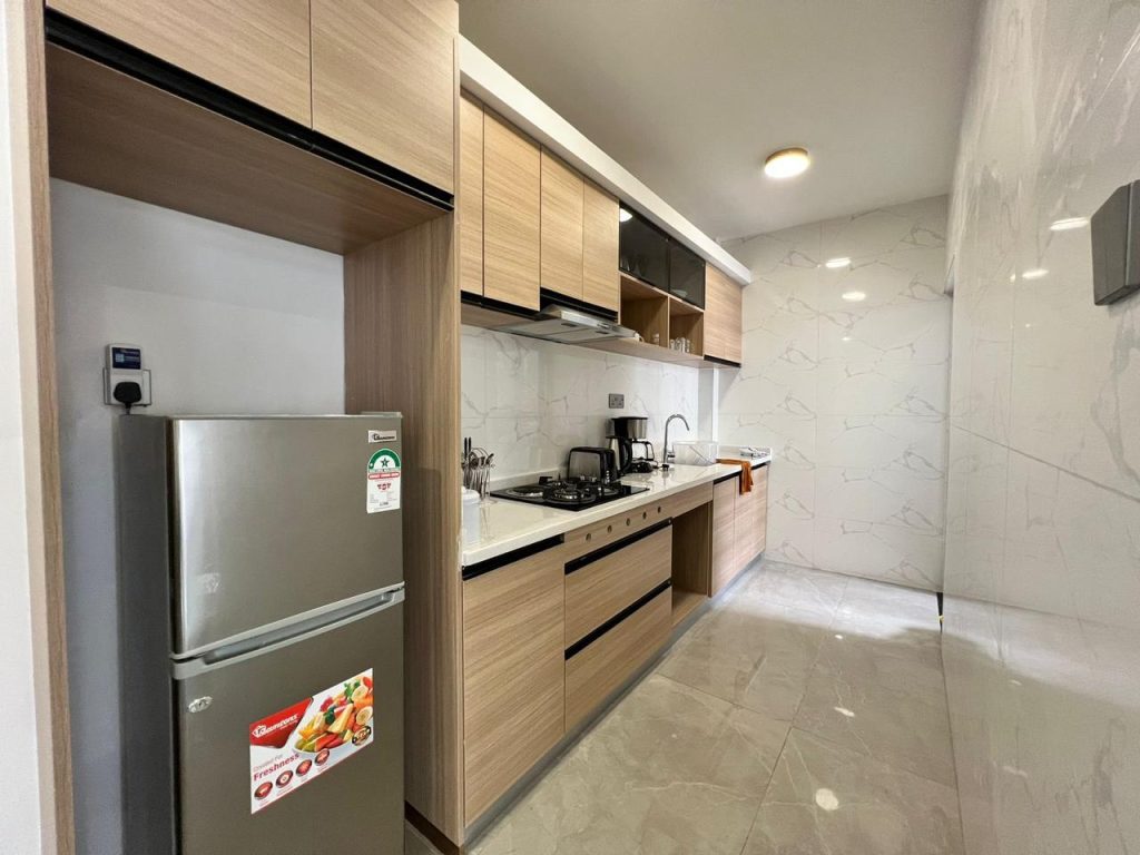 Fitted open plan Kitchen with cabinets and appliances at Furnished Apartment near Netherlands Embassy