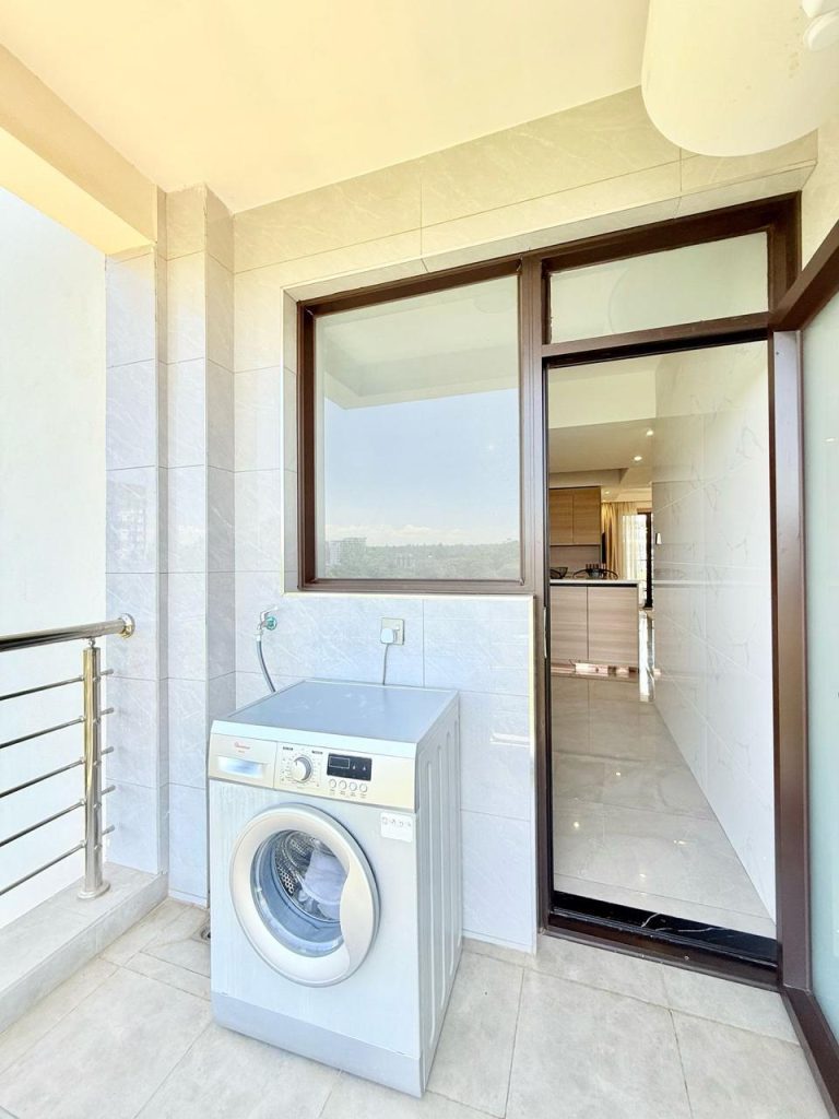 a washing machine at the laundry area of the Fully Furnished 3 bedroom Apartment in Westlands