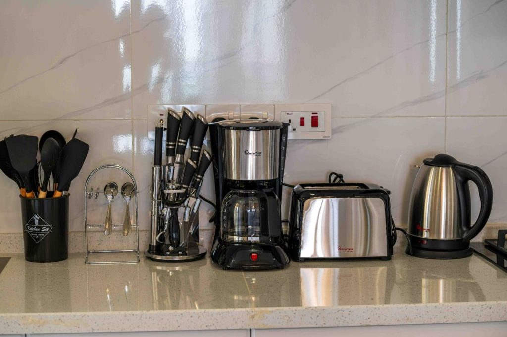 appliances at the fitted open plan kitchen at Family-friendly serviced apartment in Kilimani