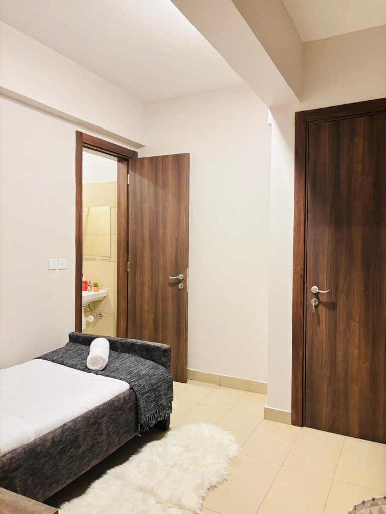 an ensuite bedroom at the Furnished 3 bedroom Apartment in Gated Community