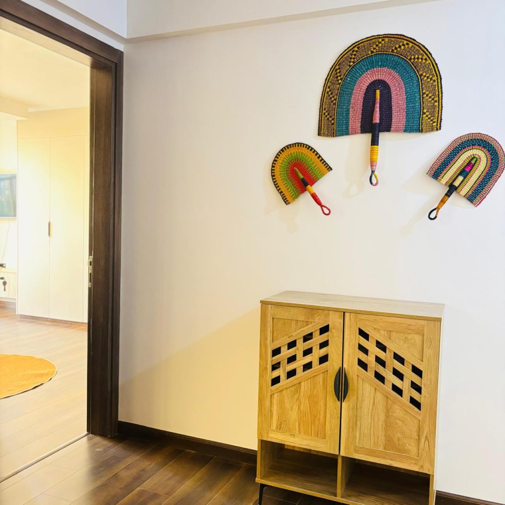 a console table and art outside a bedroom at Furnished 3 bedroom Apartment in Gated Community