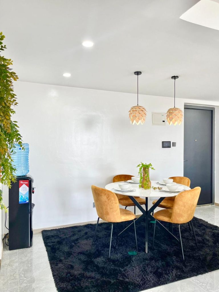 dining table set up for four at the Two Bedroom Furnished Apartment for rent in Nairobi