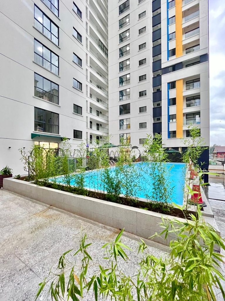 the exterior view of the development building and the swimming pool at Two Bedroom Furnished Apartment for rent in Nairobi