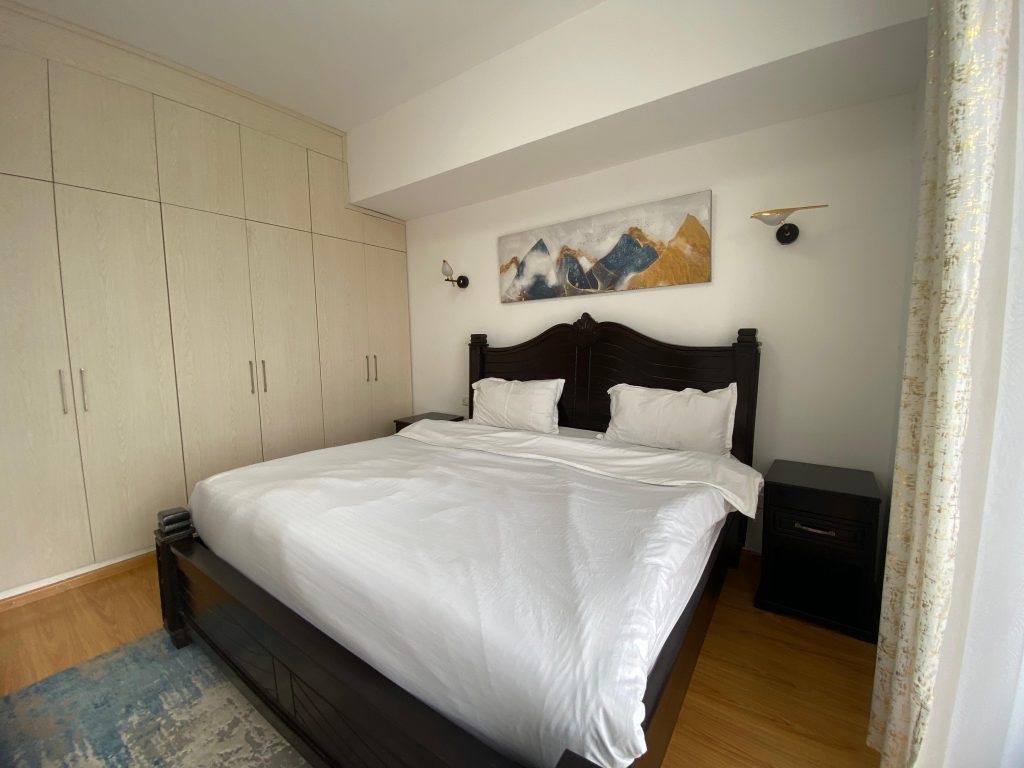 a king size bed with view of the inbuilt wardrobes Furnished 3 Bedroom Apartment For rent in Kenya