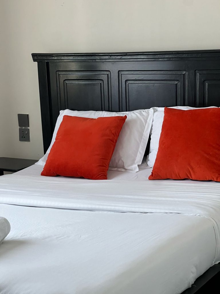 a king size bed in the bedroom of the Short Stay Furnished Apartment in Nairobi