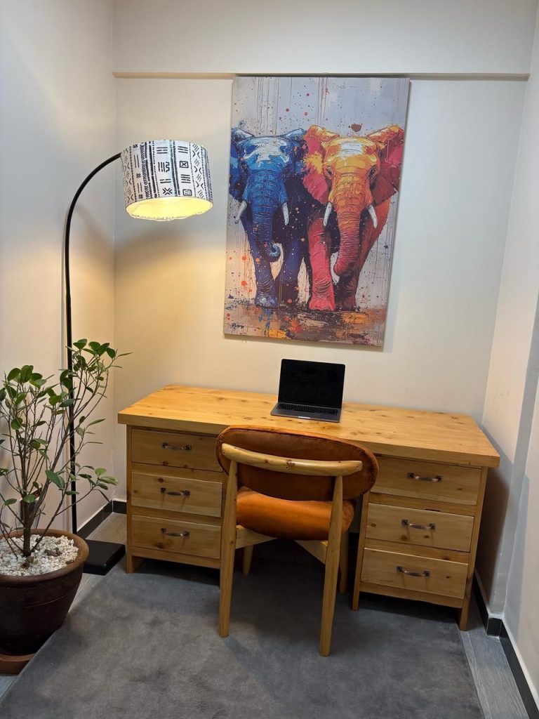 a dedicated study area with overhead lighting and work desk at the Short Stay Furnished Apartment in Nairobi