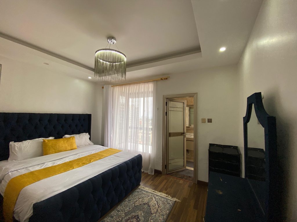 the first bedroom at Kilimani Furnished 2 Bedroom Apartment with Heated Pool