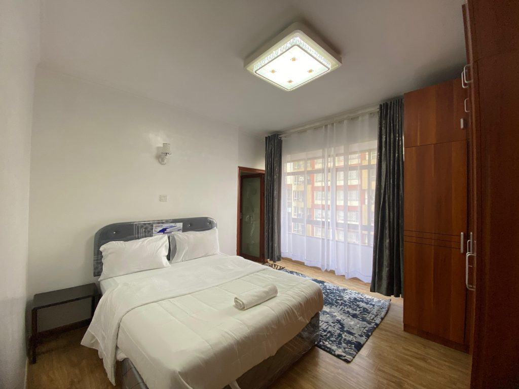 the first bedroom of the Fully Serviced 3 Bedroom Apartment in Kilimani