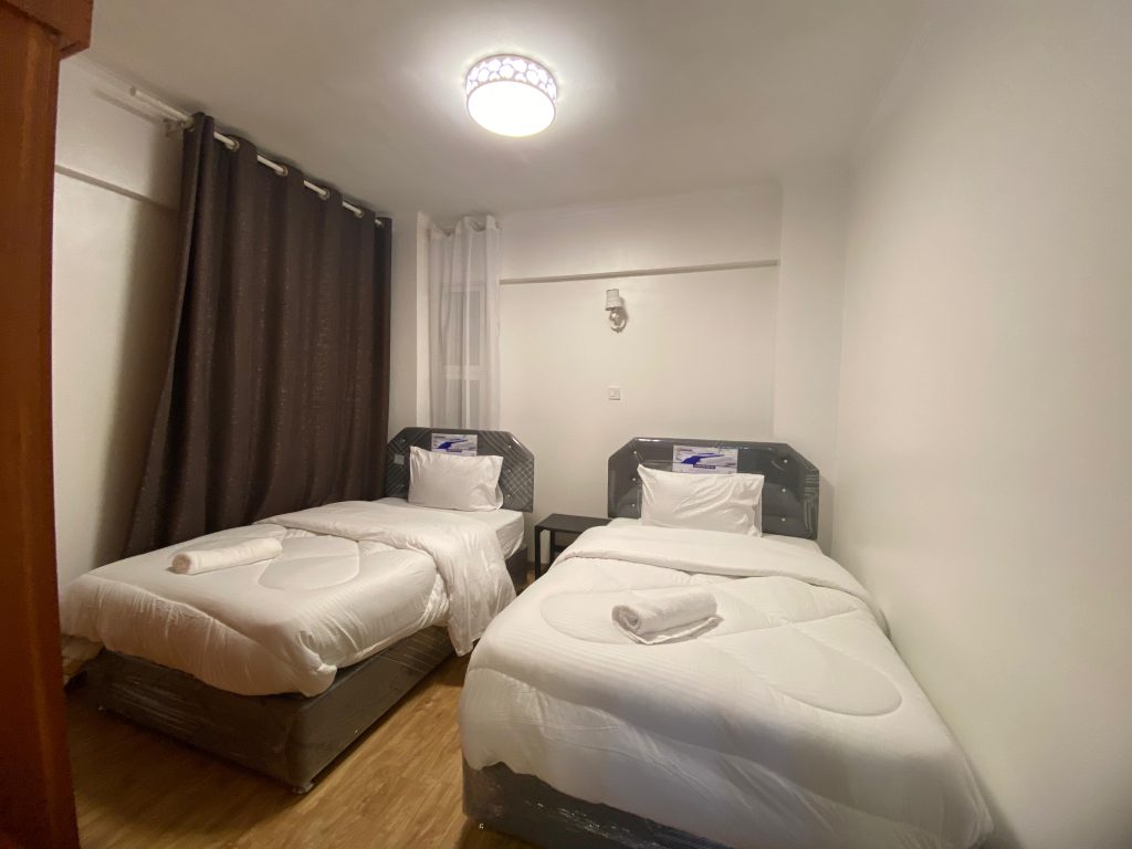 the second bedroom of the Fully Serviced 3 Bedroom Apartment in Kilimani with 2 beds