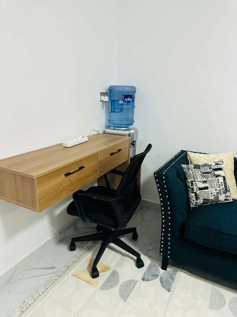 a study desk and a chair at the Furnished Studio Airbnb in Kilimani Nairobi