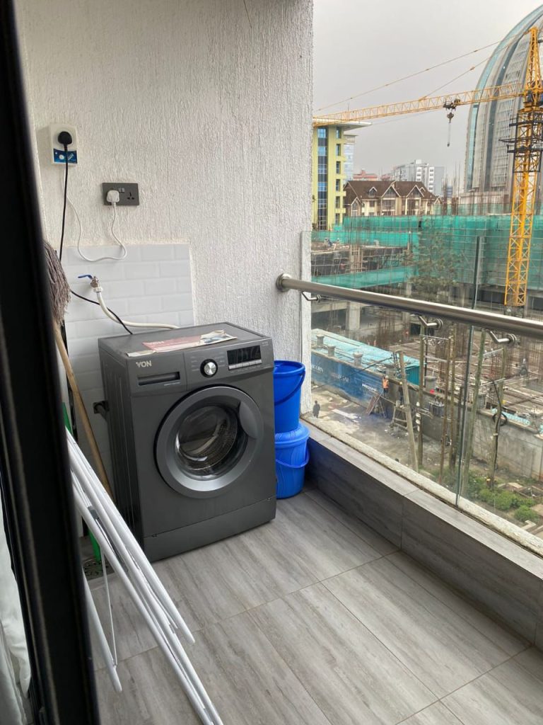 a washing machine at Furnished 1 bed apartment near Kilimani mall