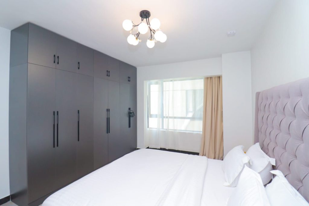 bedroom with the view of the inbuilt of wardrobes at Furnished 3 Bedroom Airbnb in Kilimani