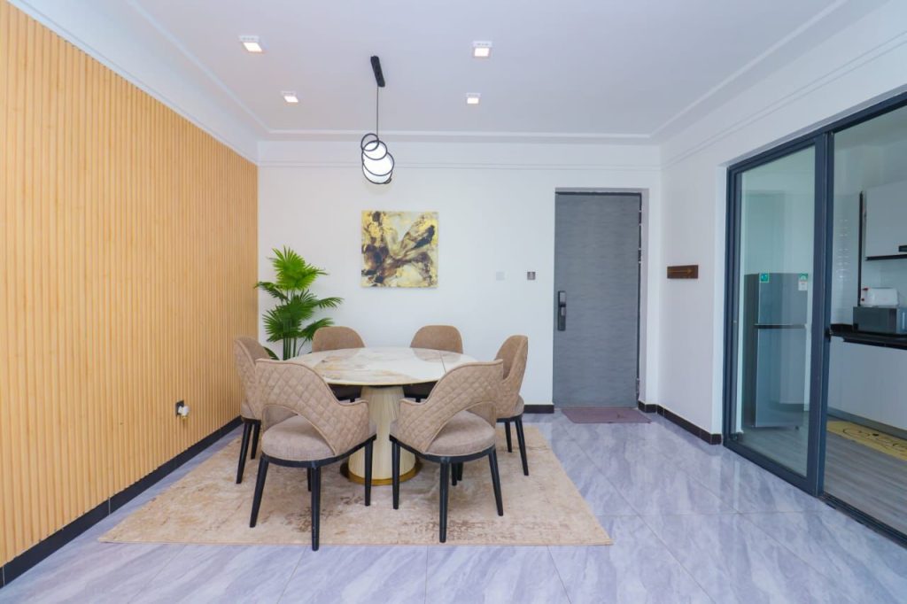 An expansive dining area with a table at Furnished 3 Bedroom Airbnb in Kilimani