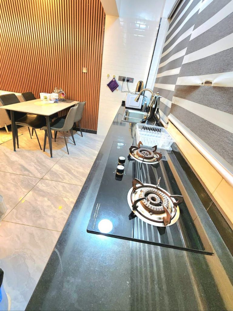 the kitchen and the dining area at Luxury 1 bedroom apartment near Yaya Kilimani