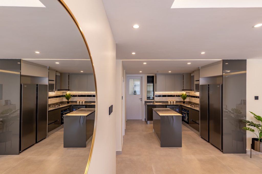 The whole view of the open plan kitchen at greenvile apartment