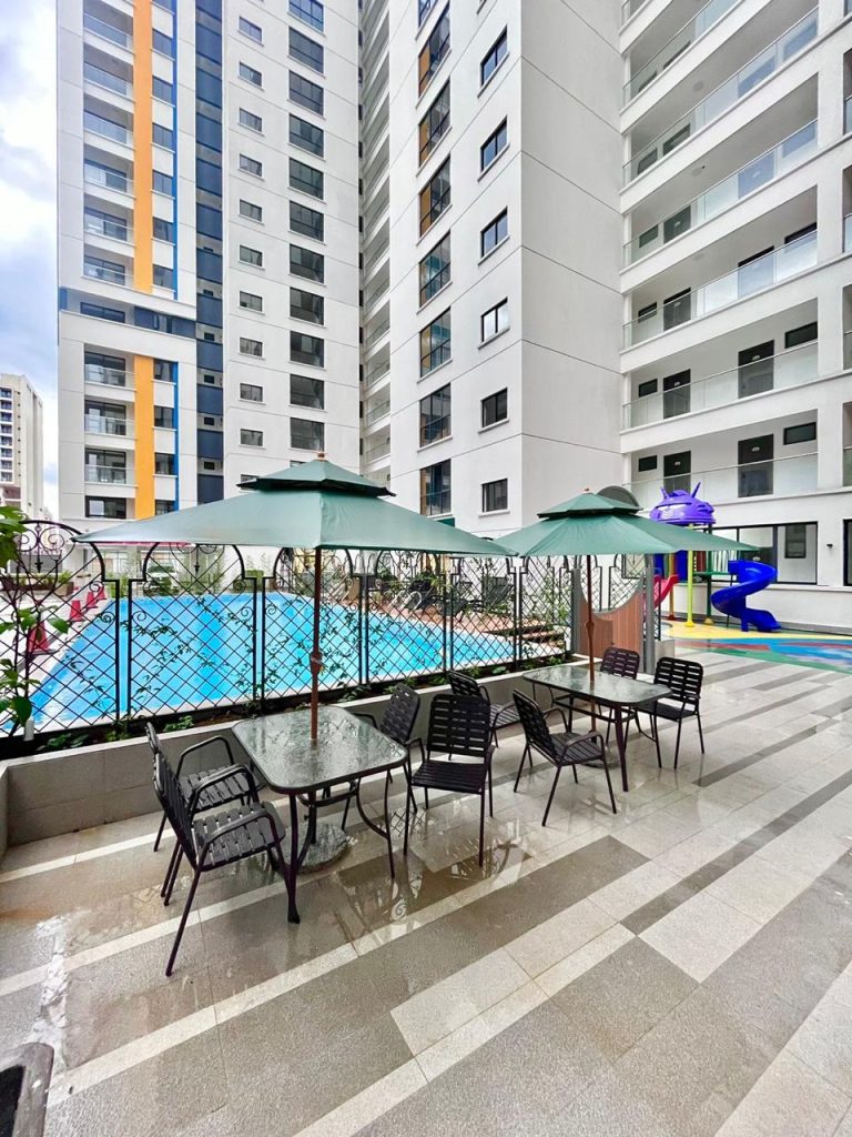 The exterior view of the swimming pool, the buildiongs and the basking lounge at the Business accommodation near Yaya Centre Kilimani