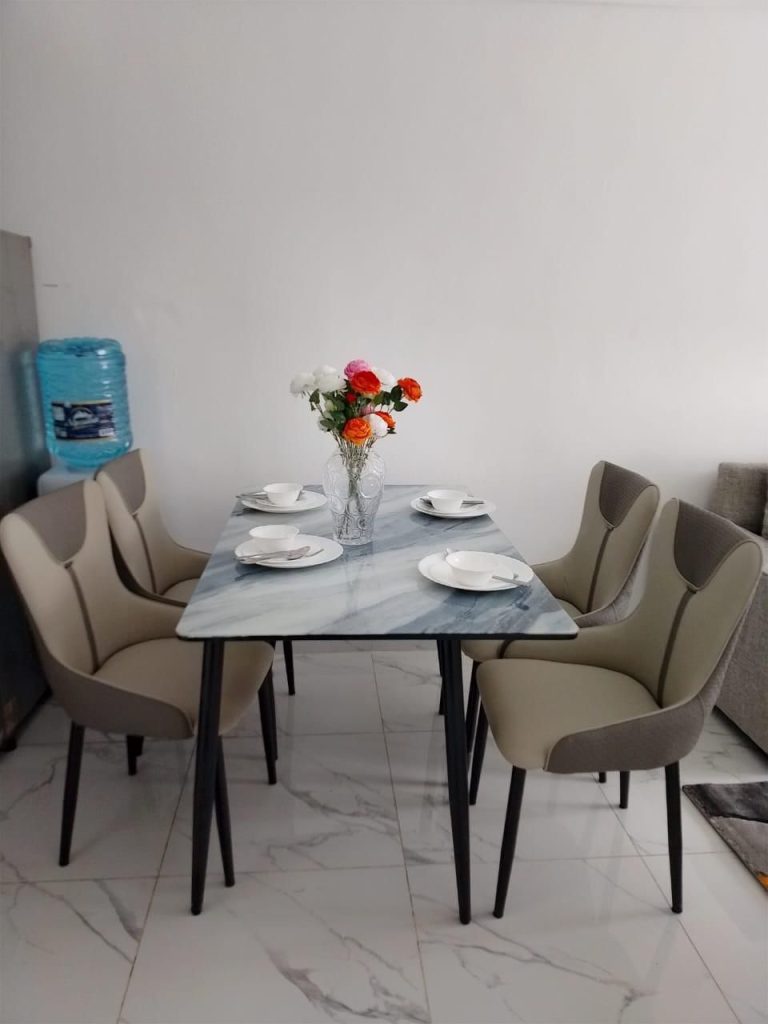 dining area with table set up for four at Premium Rental Home in Kilimani for professionals