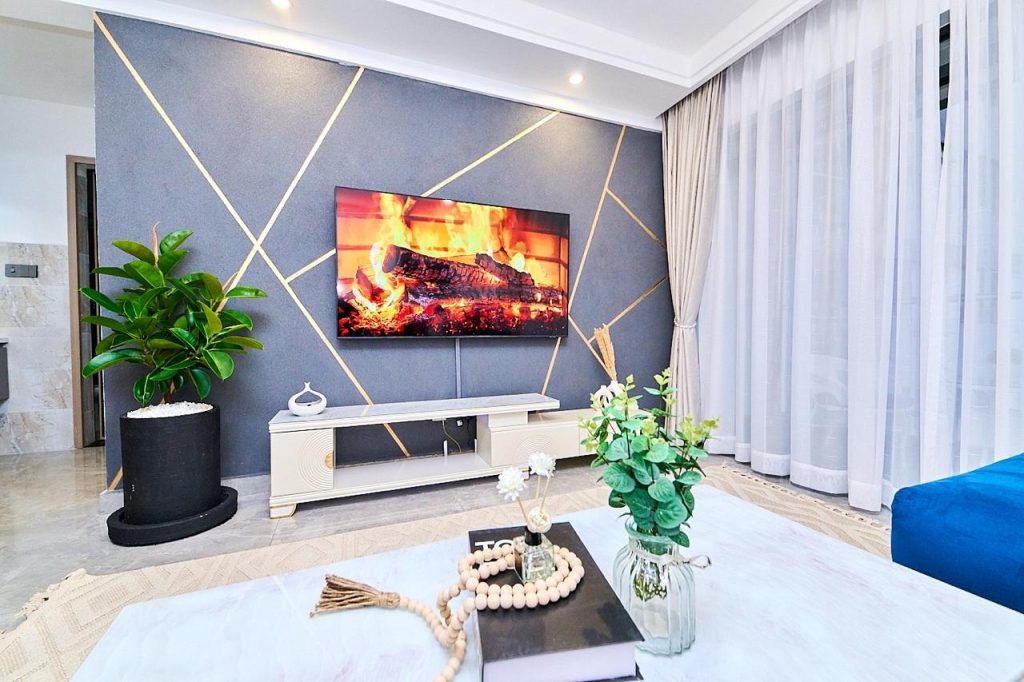 Flat-screen TV setup in the sitting area of pay per night apartment in Lavington Nairobi.