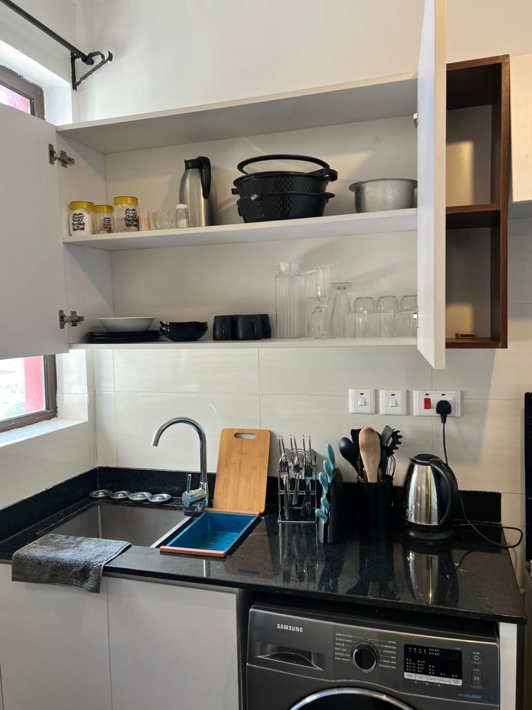 kitchen sink and appliance inside the Furnished Apartment Under 100k per Month in Nairobi