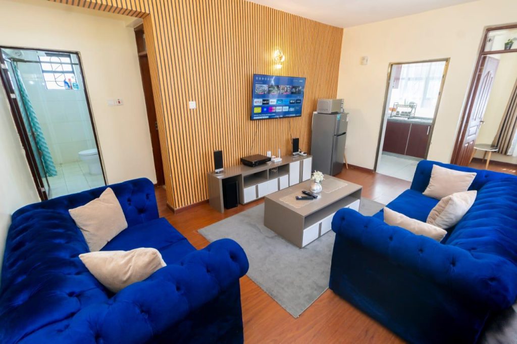 Comfortable lounge space with TV in Mararo Court Furnished Apartment in Lavington.