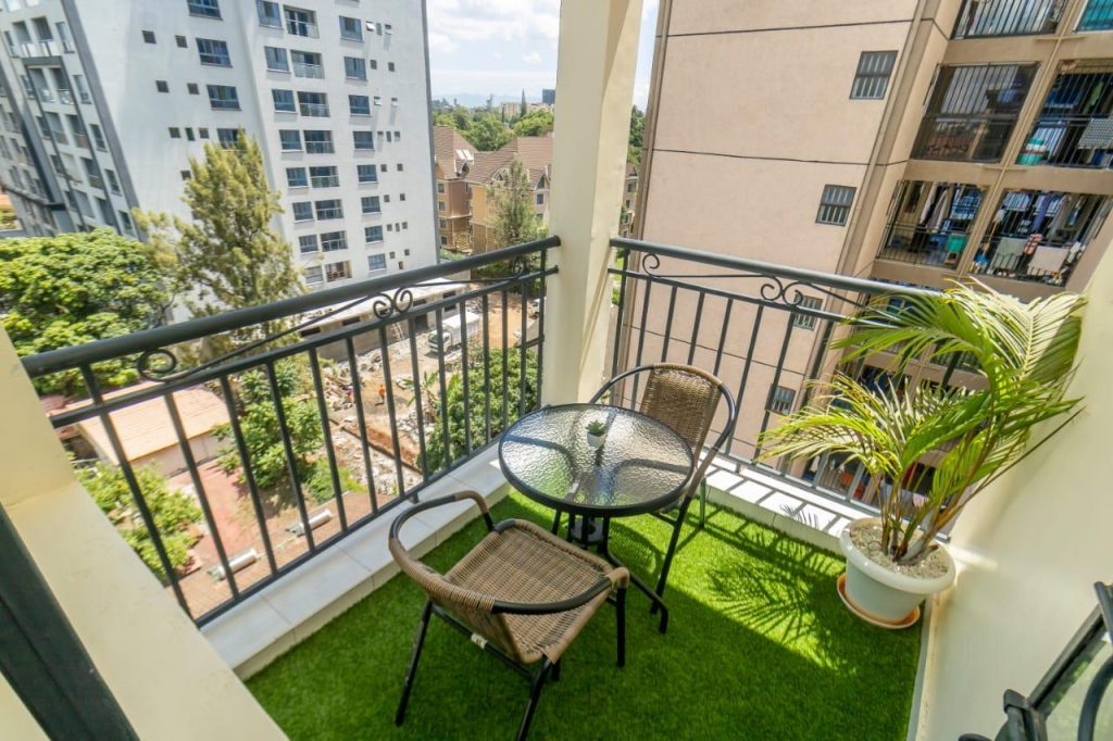 Private balcony with outdoor seating at Mararo Court Furnished Apartment in Lavington.