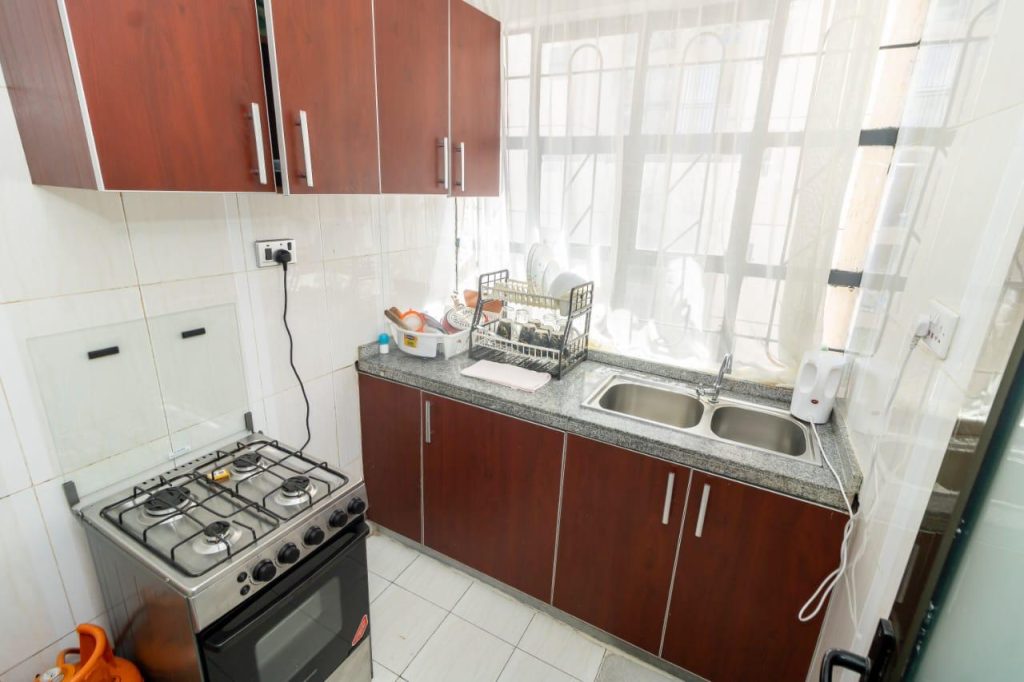 equipped kitchen in Mararo Court Furnished Apartment in Lavington with modern appliances.