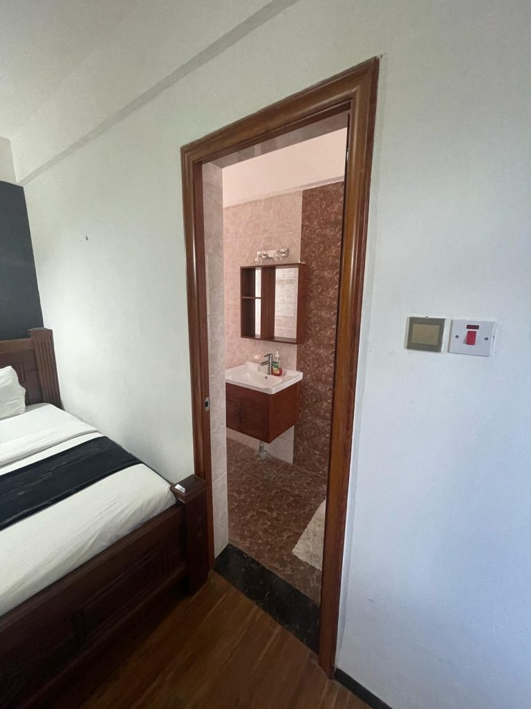 an ensuite bedroom at cheap serviced 2 bedroom apartment in Nairobi