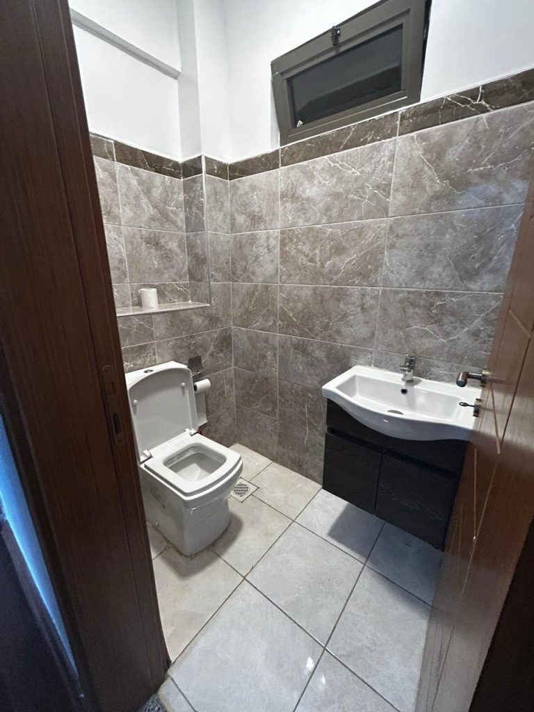 a bathroom and a sink inside the Serviced and Furnished 3 Bedroom Apartment Nairobi