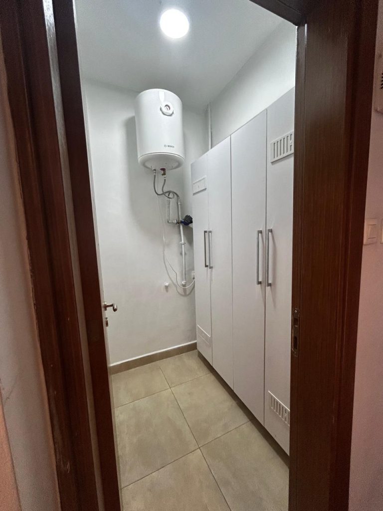 a walk in closet in the master bedroom of the Serviced and Furnished 3 Bedroom Apartment Nairobi