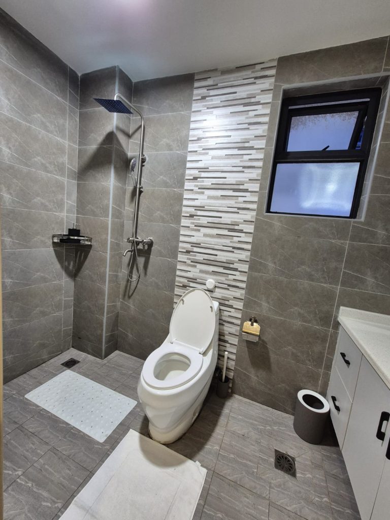 Modern bathroom with a shower and toilet – Serviced Furnished Apartment in Westlands Nairobi.