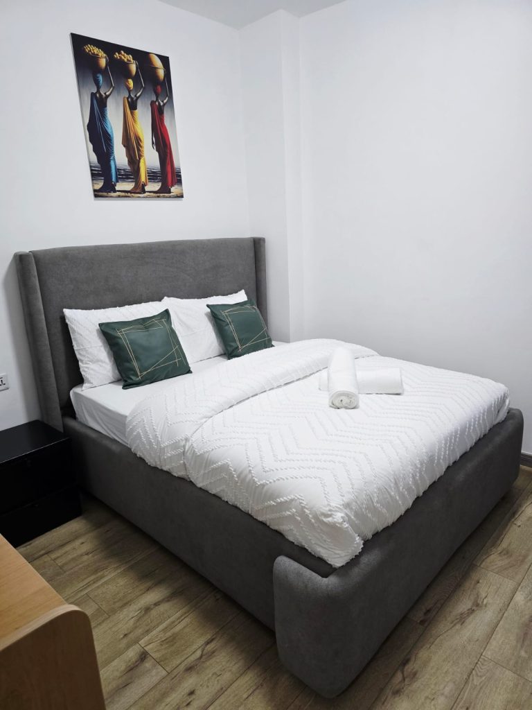 Bedroom with a king-size bed and stylish furnishings – Serviced Furnished Apartment in Westlands Nairobi.