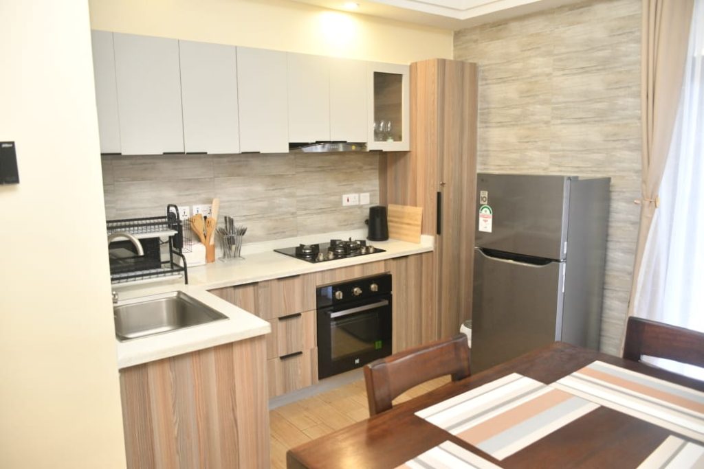 open plan fitted kitchen with appliances at Short Let Furnished Apartment in Westlands Nairobi