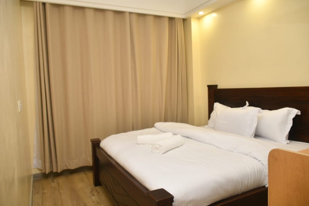 queen size comfortable bed inside the Short Let Furnished Apartment in Westlands Nairobi