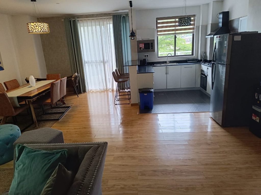 Fully equipped open plan kitchen in a modern furnished duplex apartment in Kilimani for short stays