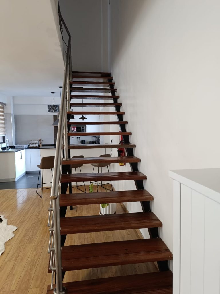 Stylish staircase inside a Serviced 2 Bedroom Duplex Apartment in Nairobi