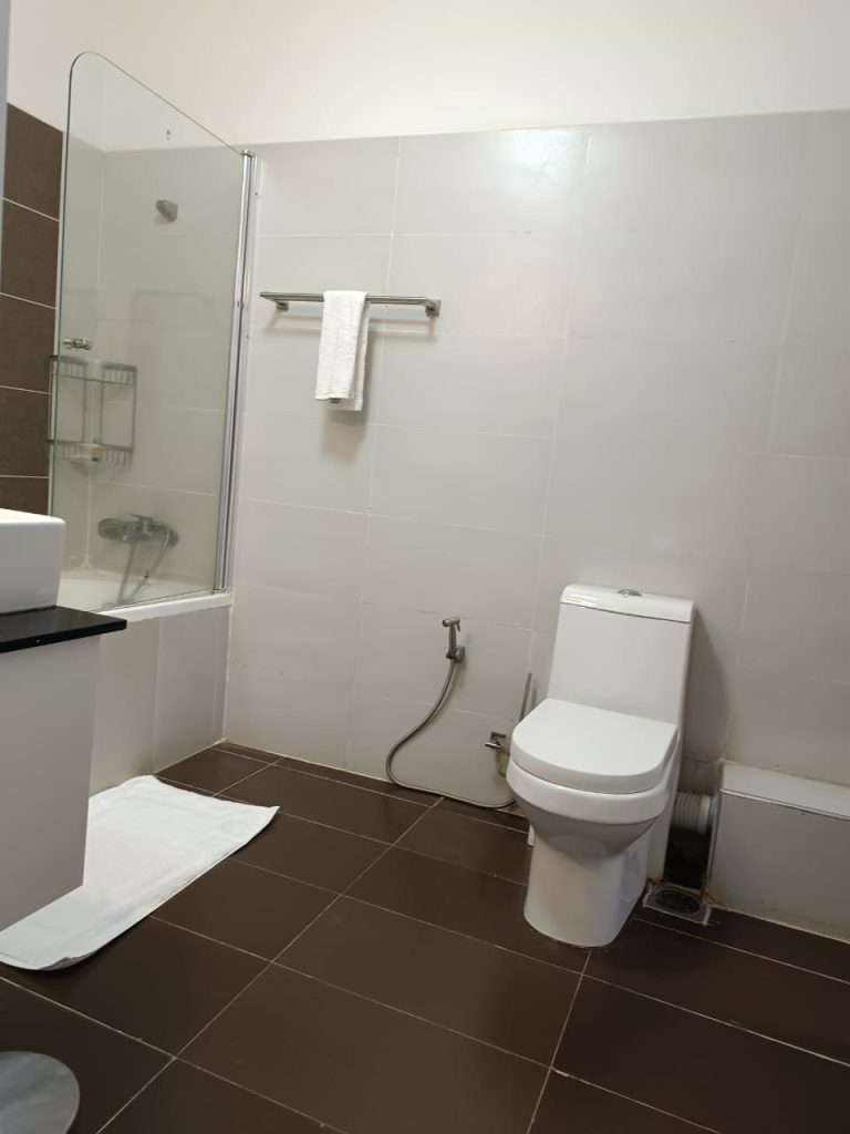 Toilet area in a well-maintained bathroom – Serviced 2 Bedroom Duplex Apartment in Nairobi