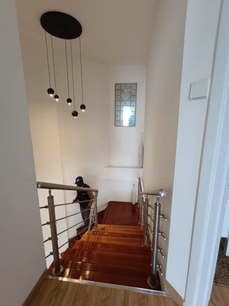 Top-down view of the staircase in a furnished duplex apartment for short stay in Kilimani