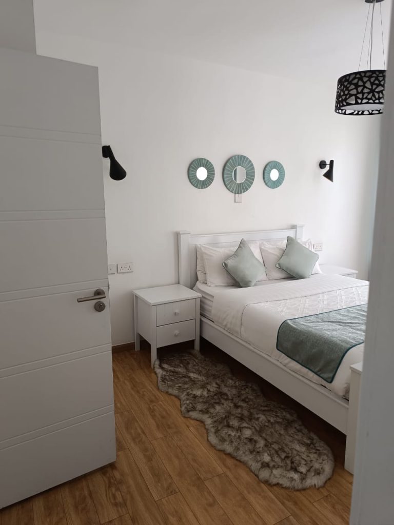 View of the bedroom from the doorway – Serviced 2 Bedroom Duplex Apartment in Nairobi