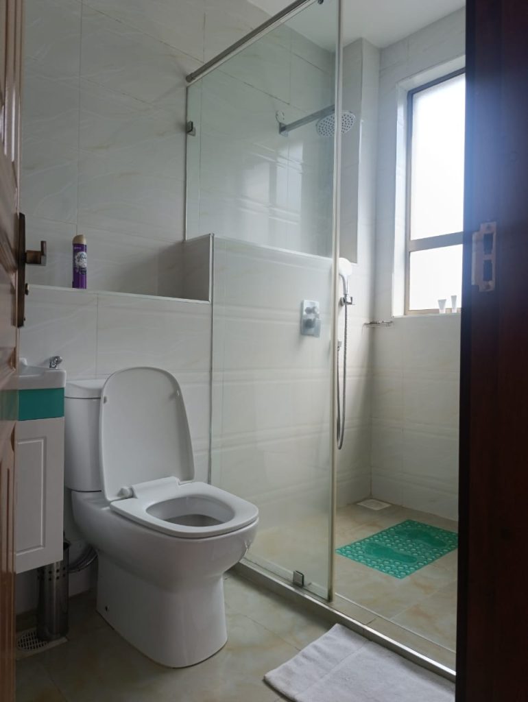 bathroom partitioned from a modern toilet at Best Furnished Apartment in Lavington Nairobi