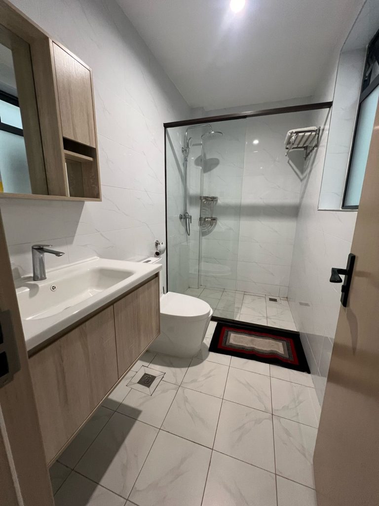 large bathroom space with cubicle showe, modern toilet and a sink at the Ruaka furnished daily and monthly rental in Nairobi