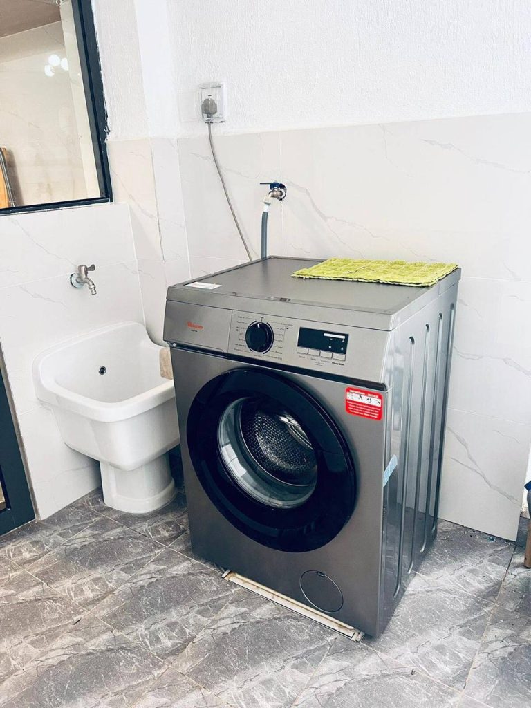 In-unit washing machine in a dedicated laundry area – Furnished 3 Bedroom Apartment Riverside Nairobi.