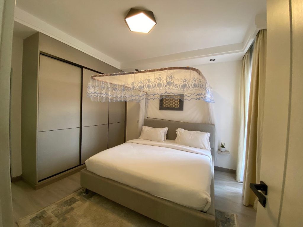 Second bedroom with queen size bed and inbuilt wardrobes in a fully furnished 2 bedroom master ensuite.
