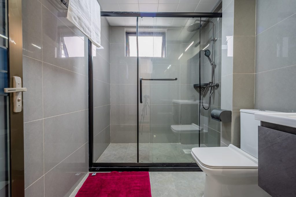 spacious shower cubicle and toilet at sheva suites