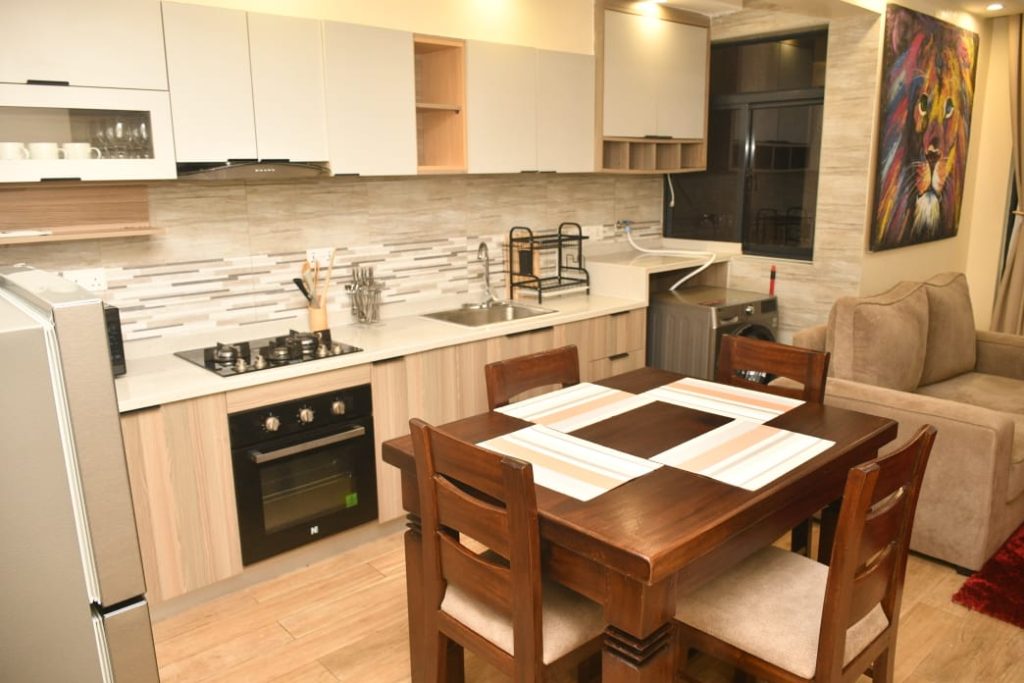 open plan kitchen and the dining area in the Executive Furnished Apartment In Kileleshwa Nairobi